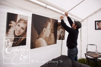 My trustworthy assistant Patrick hangs wall art in the "living room"